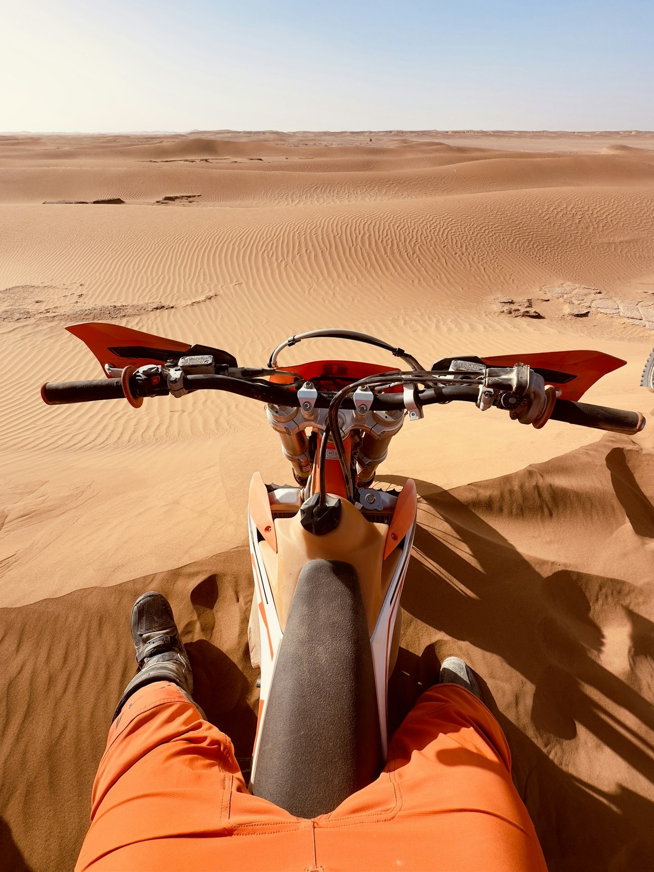 Rider in the desert at sunset