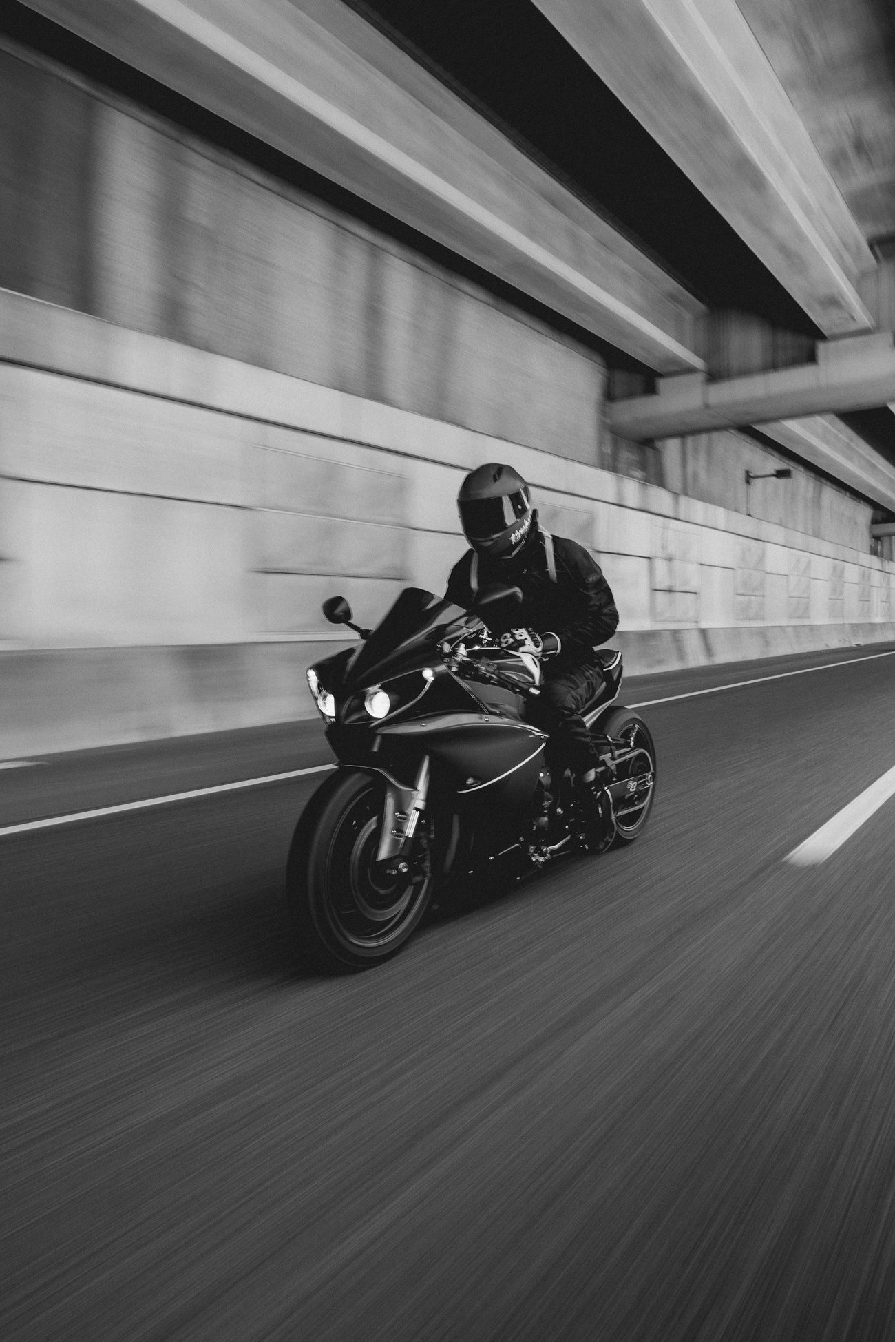 Motorcycle in motion through an underpass